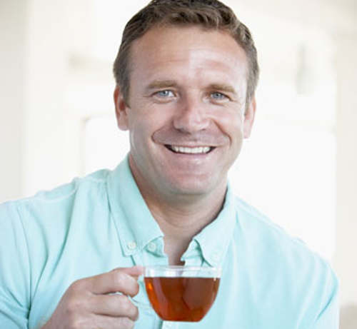 man drinking green tea